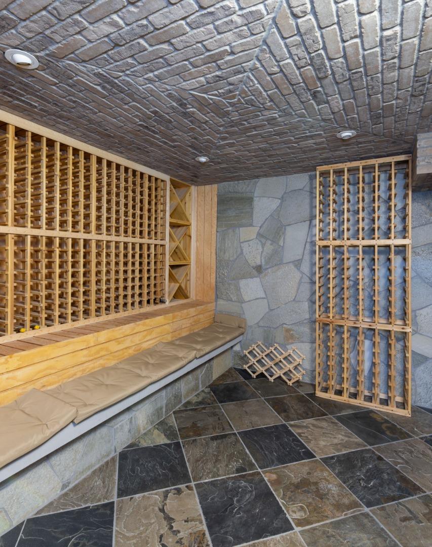 22125 Miller Ridge Road Los Gatos, CA 95033 - Photo 34 of 35 a view of a brick house with many windows