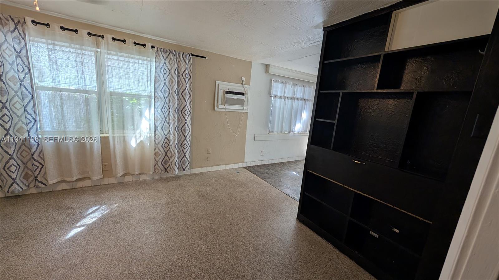 2024 Fillmore Street, Unit 1 Hollywood, FL 33020 - Photo 4 of 5 an empty room with windows