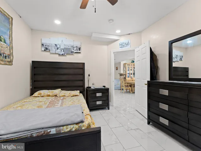 a bedroom with a bed and dresser