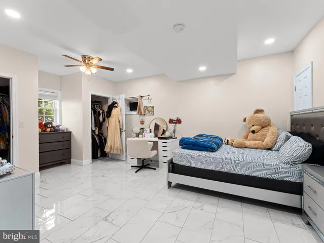 a bed room with furniture and a chandelier