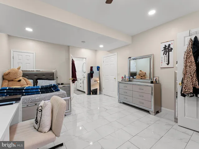 a room with furniture a flat screen tv and a sink