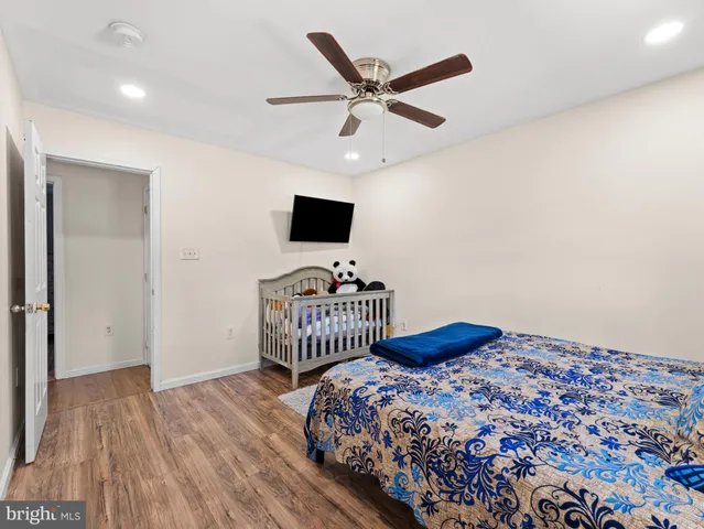 a bedroom with a bed and a tv