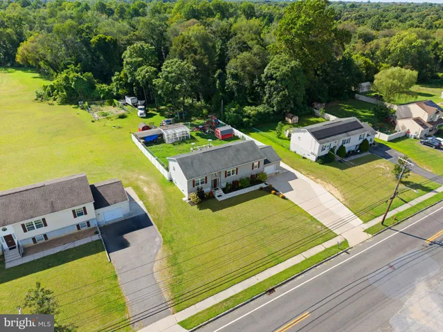 an aerial view of a house with a swimming pool