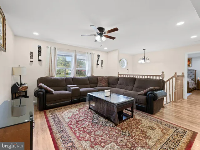 a living room with furniture and a rug
