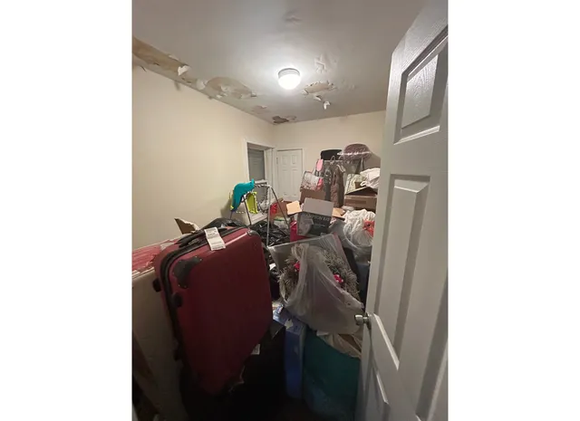 a view of storage and utility room with windows