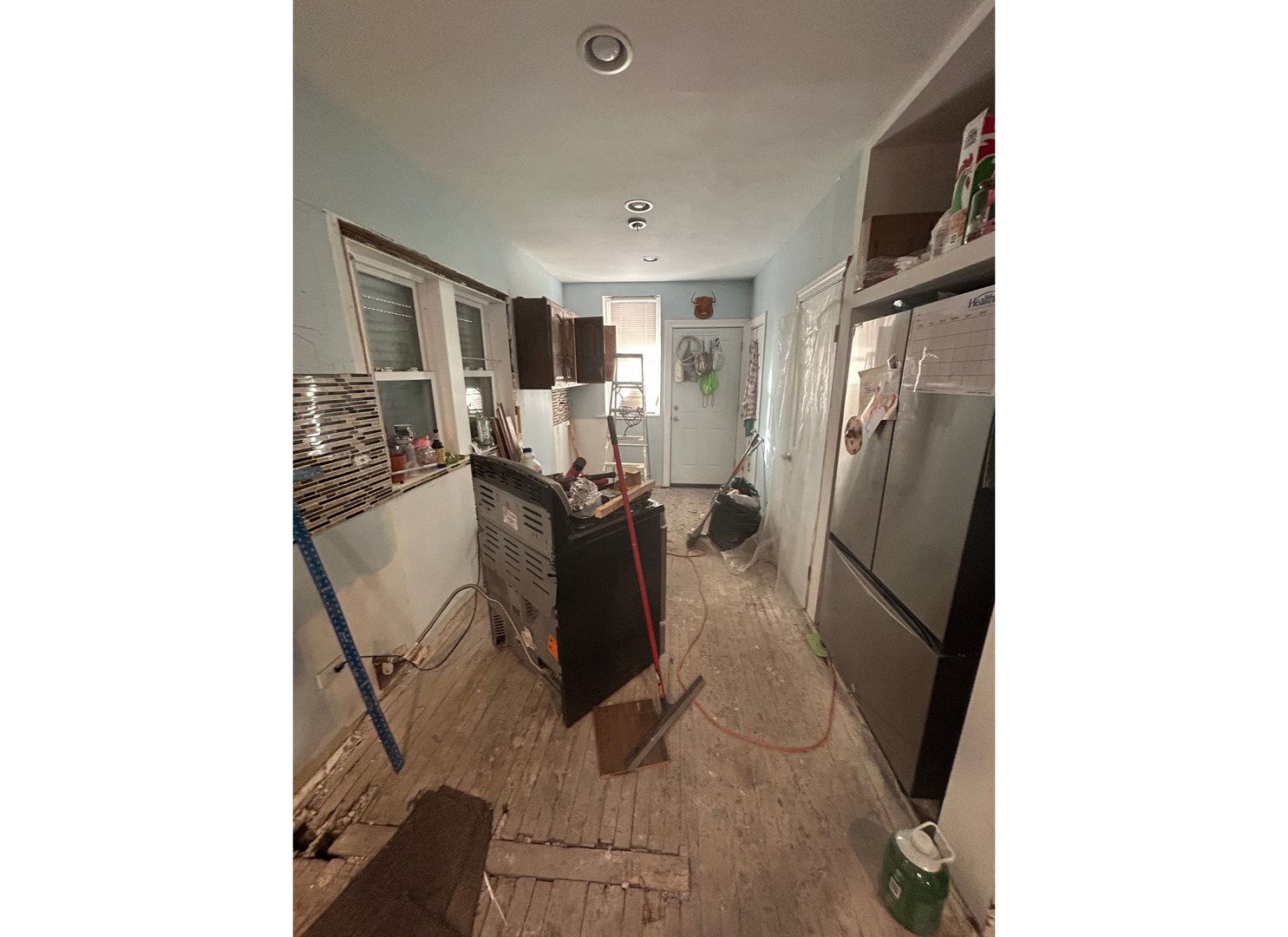 2107 West 70th Place Chicago, IL 60636 - Photo 15 of 19 a view of a living room with furniture and a window