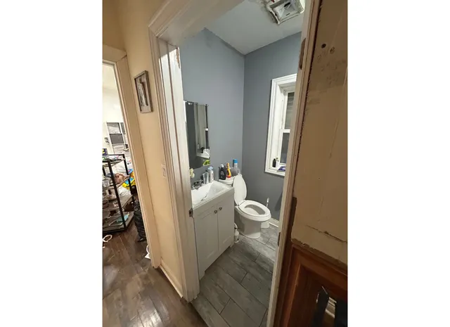 a view of a hallway with a white walls