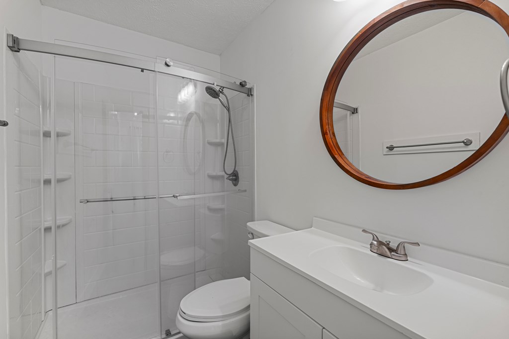 2133 13th Street Columbus, GA 31906 - Photo 15 of 15 a bathroom with a sink a toilet and a mirror