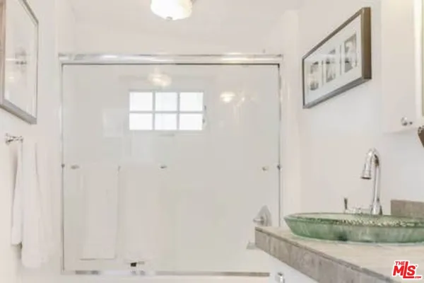 a bathroom with a sink and a granite counter top