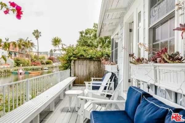 a view of balcony with furniture