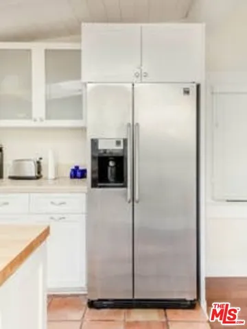 a bathroom with a shower and a sink