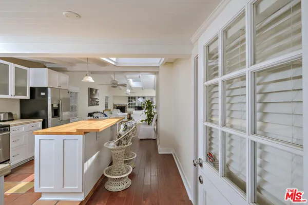 a large kitchen with a table and chairs
