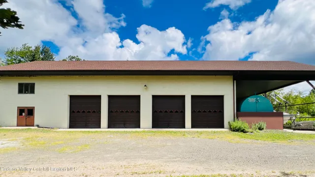 a front view of a house with a garden and entryway