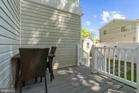 a view of backyard with a garden and deck