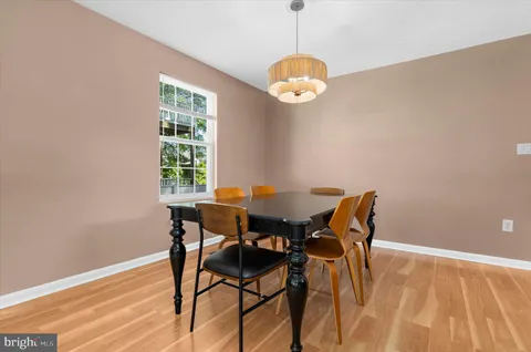 a kitchen with a table and chairs