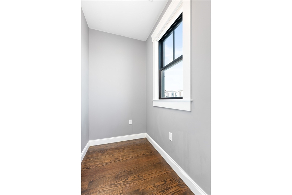 229 East Eagle Street, Unit 3 Boston, MA 02128 - Photo 15 of 17 a hallway with a large window