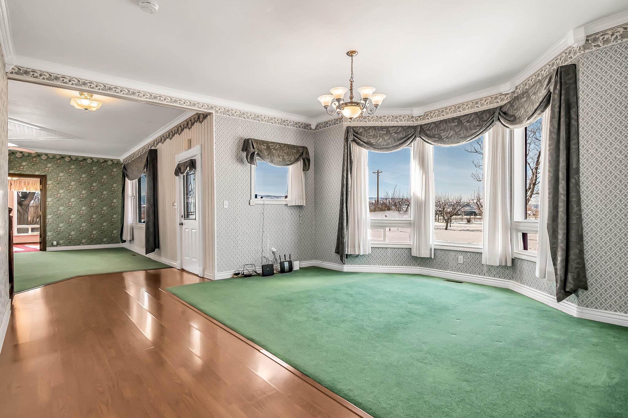 2024 L Road Grand Junction, CO 81505 - Photo 5 of 37 a view of a big room with windows and chandelier
