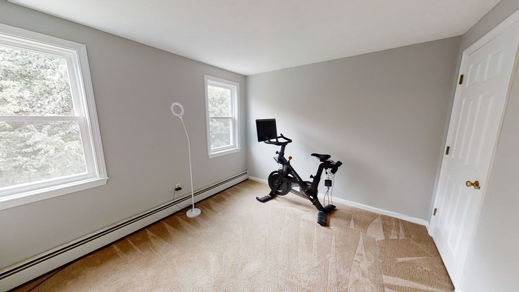 22 Cheyenne Road Worcester, MA 01606 - Photo 14 of 24 a view of a room with gym equipment and windows