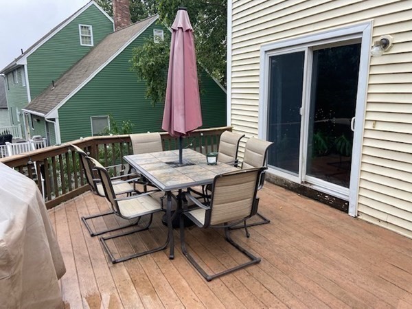 22 Cheyenne Road Worcester, MA 01606 - Photo 20 of 24 a table and chairs sitting in front of a house