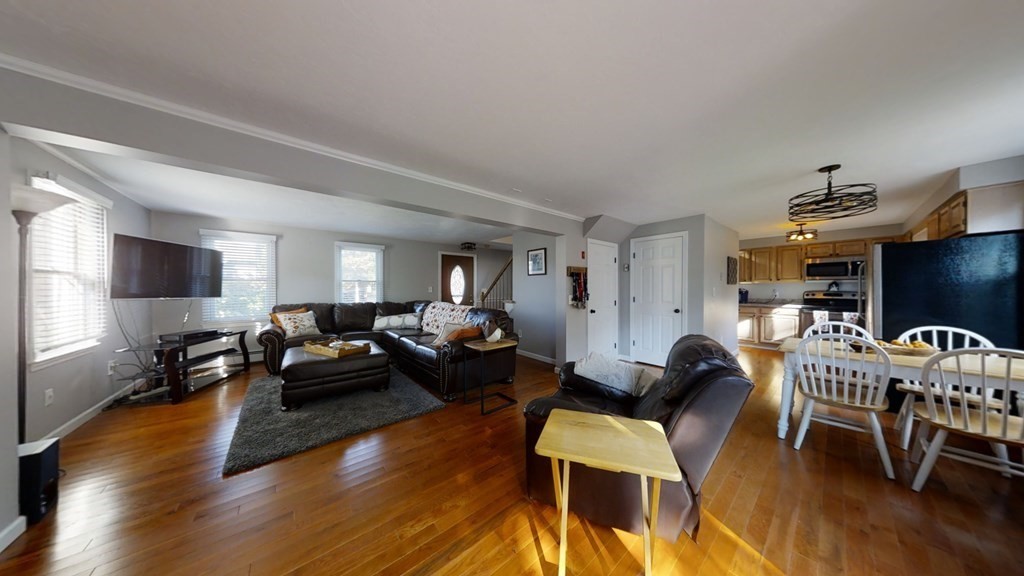 22 Cheyenne Road Worcester, MA 01606 - Photo 2 of 24 a living room with furniture and a wooden floor