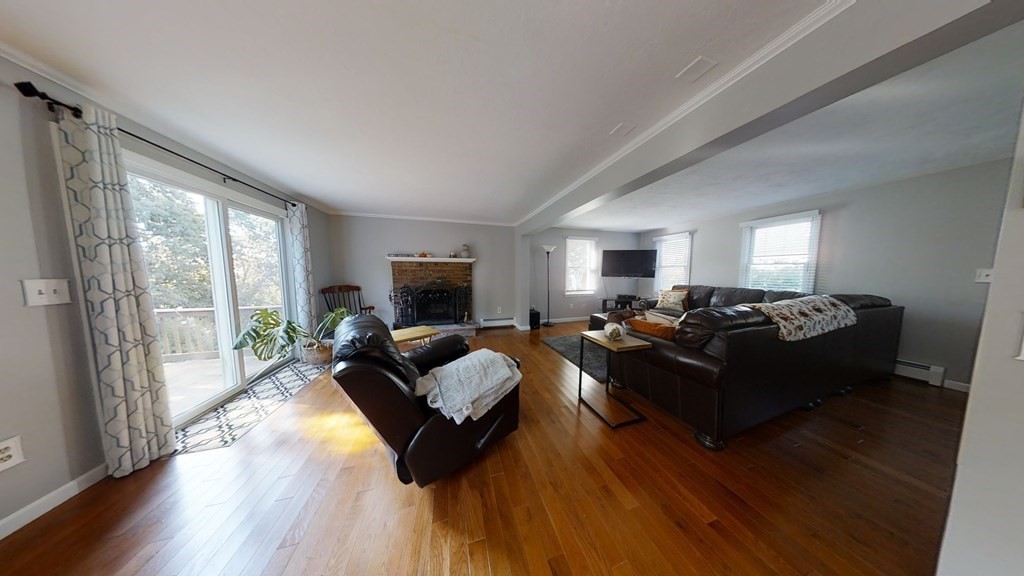 22 Cheyenne Road Worcester, MA 01606 - Photo 3 of 24 a living room with furniture and a flat screen tv