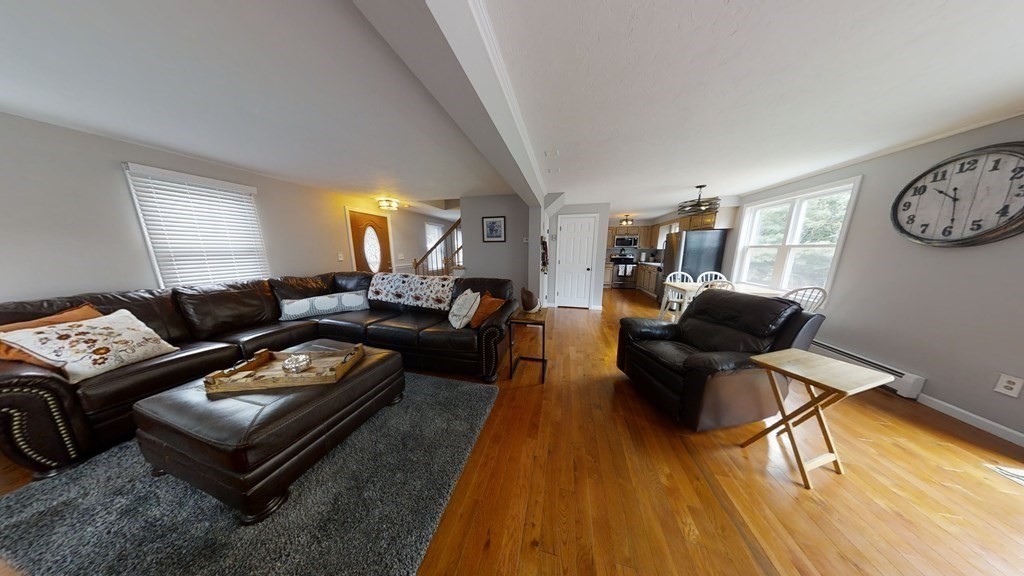 22 Cheyenne Road Worcester, MA 01606 - Photo 4 of 24 a living room with furniture and a wooden floor