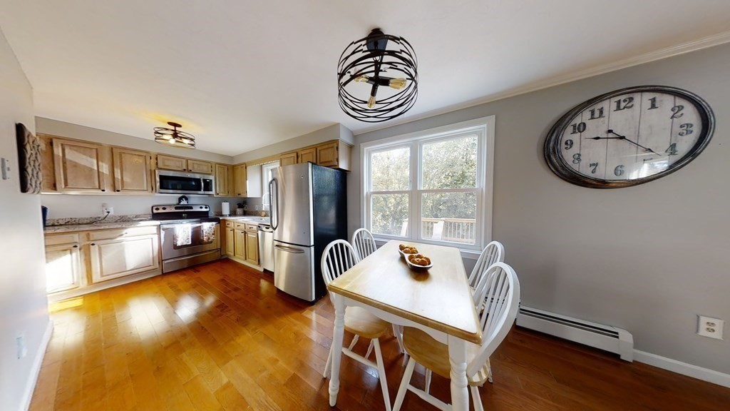 22 Cheyenne Road Worcester, MA 01606 - Photo 5 of 24 a view of a kitchen with a table and chairs