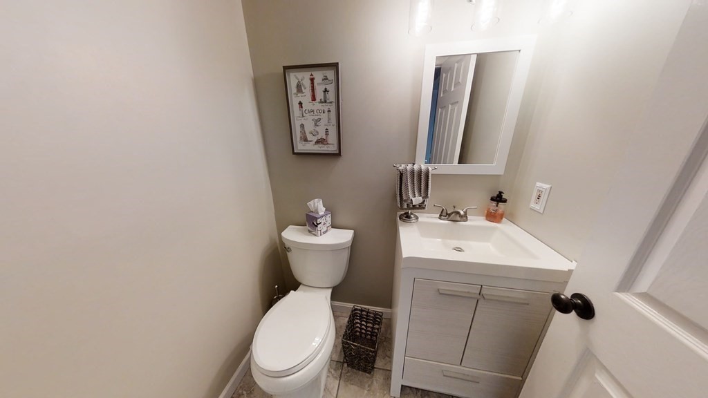 22 Cheyenne Road Worcester, MA 01606 - Photo 8 of 24 a white toilet sitting next to a bathroom sink