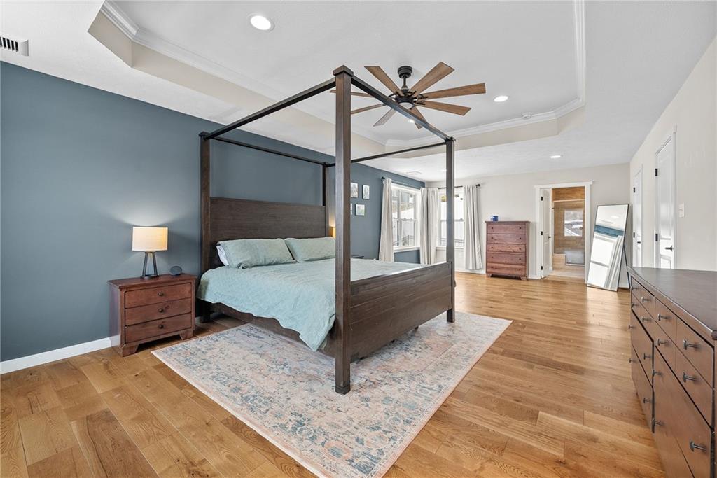 141 Morningstar Drive Belle Vernon, PA 15012 - Photo 20 of 39 a spacious bedroom with a bed a rug and wooden floor