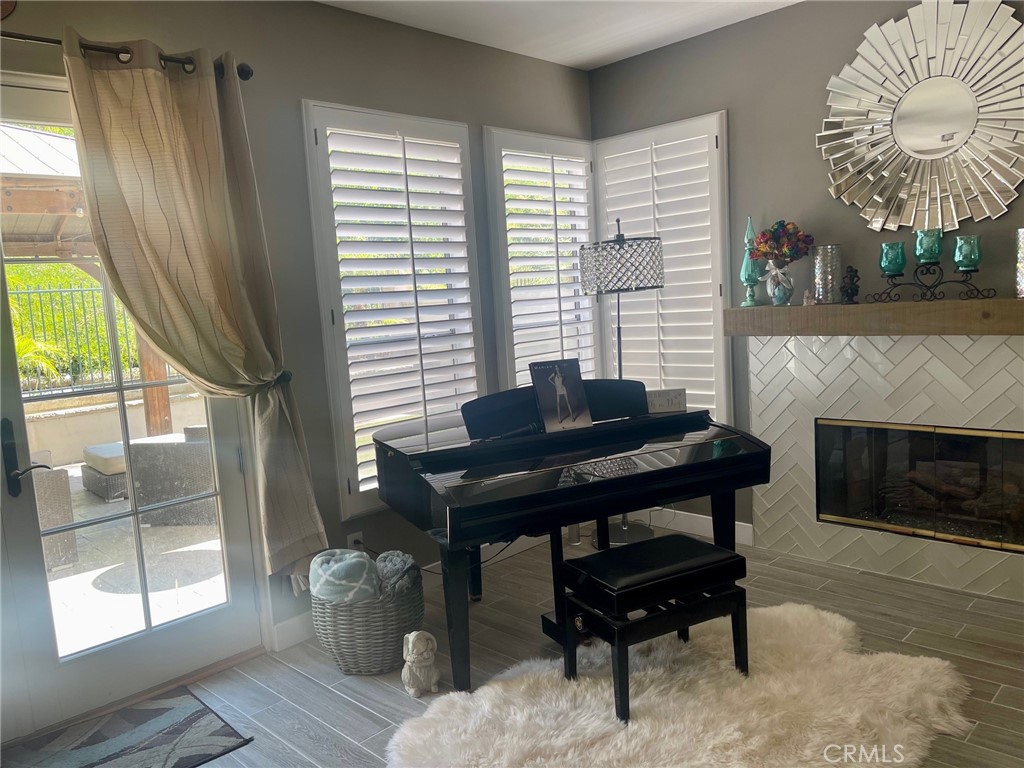 45 Blazewood Lake Forest, CA 92610 - Photo 6 of 13 a living room with furniture a window and a fireplace