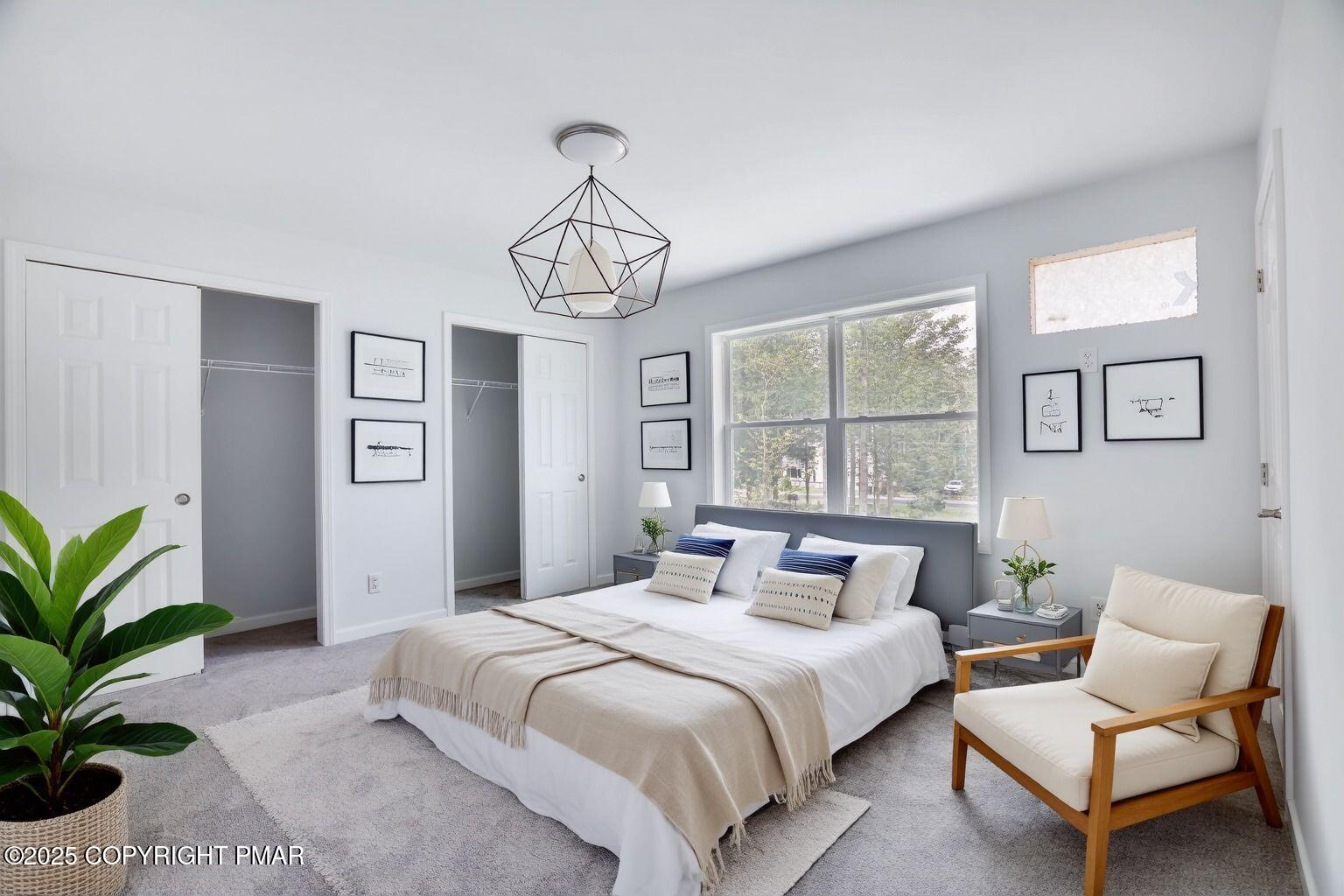 8475 Bumble Bee Way Tobyhanna, PA 18466 - Photo 5 of 28 a bedroom with a large bed and a chandelier