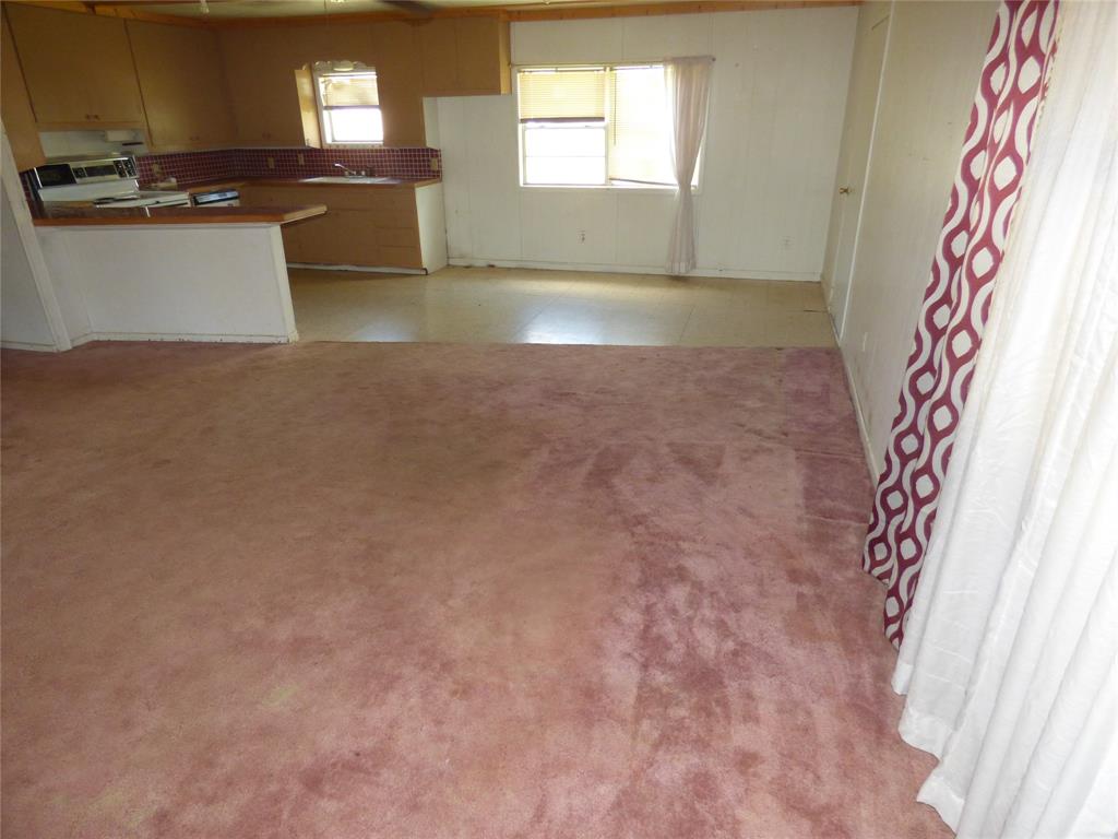 309 East 10th Street Cisco, TX 76437 - Photo 14 of 35 a view of a kitchen with a sink