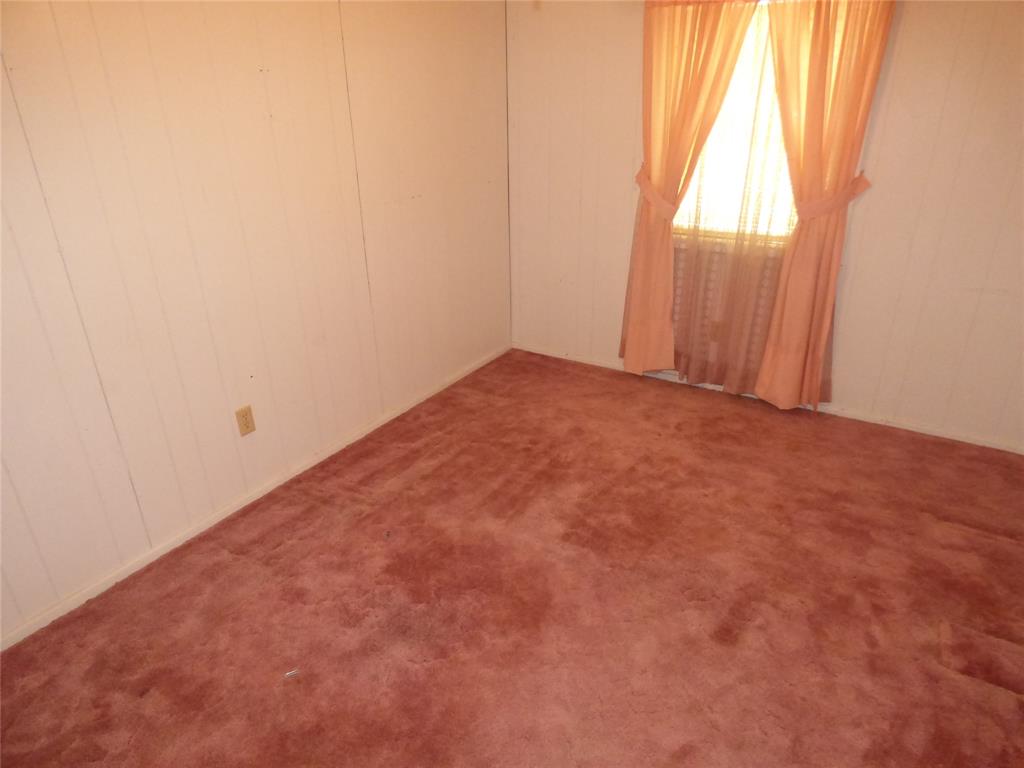 309 East 10th Street Cisco, TX 76437 - Photo 23 of 35 an empty room with windows