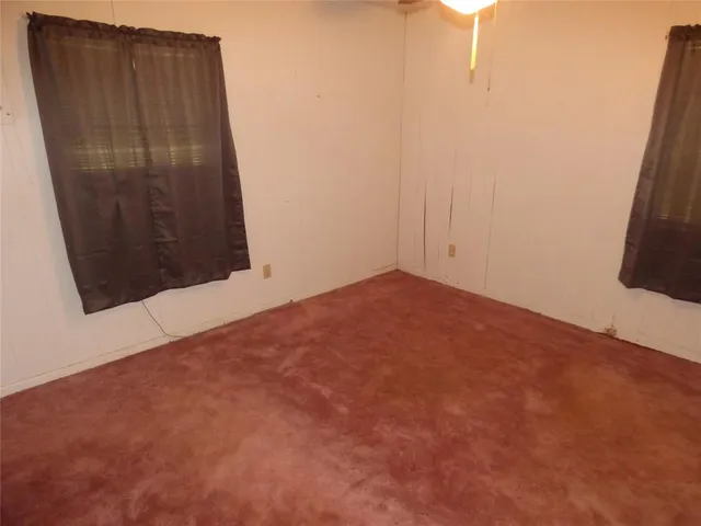 an empty room with wooden floor