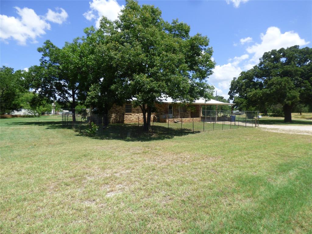 309 East 10th Street Cisco, TX 76437 - Photo 4 of 35 a view of a house with a yard