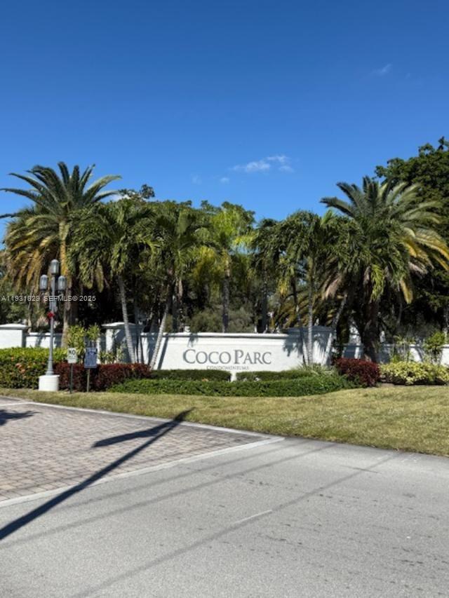 621 Lyons Road, Unit 9201 Coconut Creek, FL 33063 - Photo 1 of 28 a view of a yard with palm trees