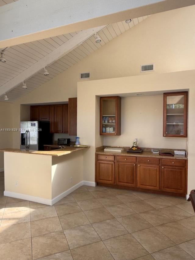 621 Lyons Road, Unit 9201 Coconut Creek, FL 33063 - Photo 18 of 28 a large kitchen with kitchen island granite countertop lots of counter top space