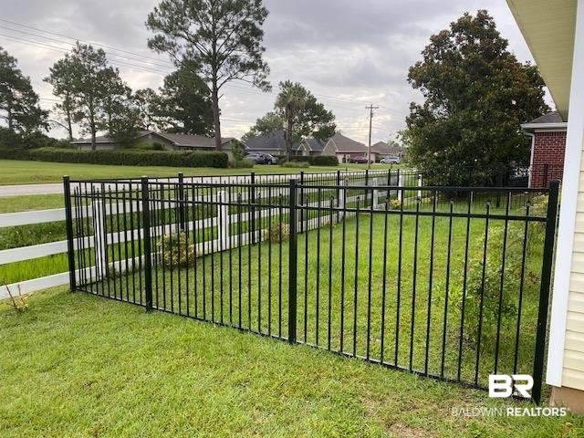 22713 Respite Lane Foley, AL 36535 - Photo 31 of 35 View of gate featuring a lawn