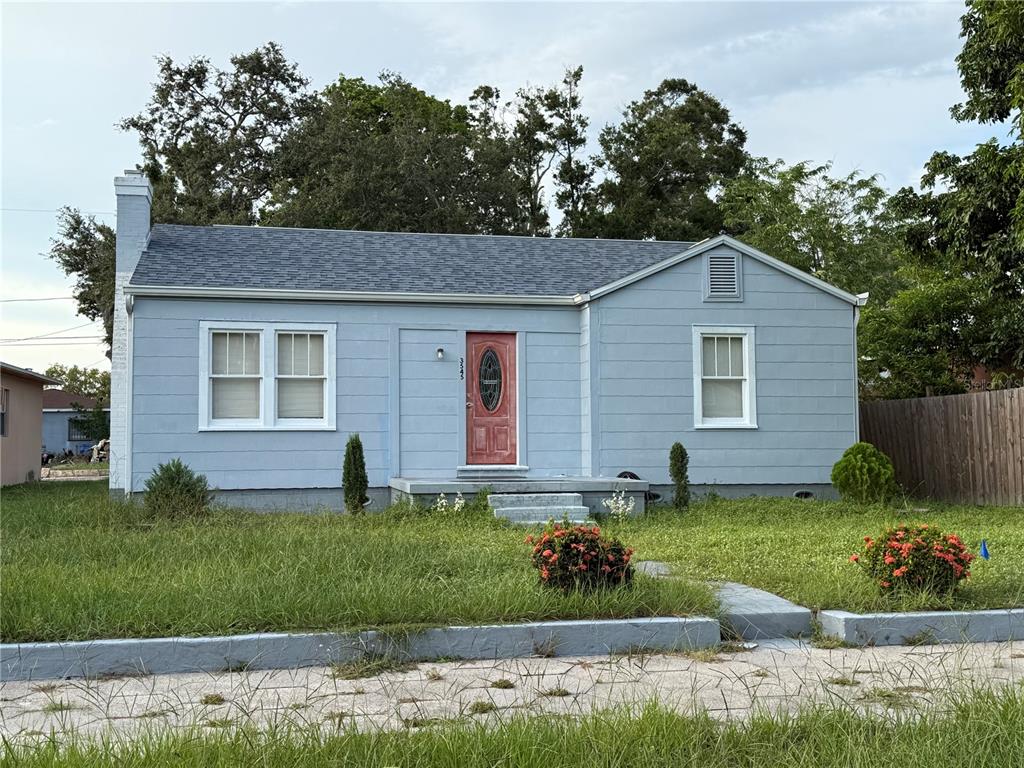 front view of a house with a yard