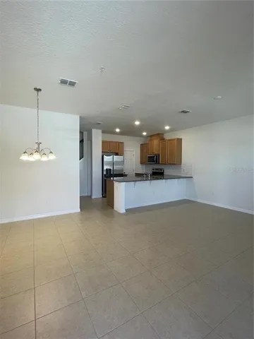 a view of a kitchen with a sink and a microwave