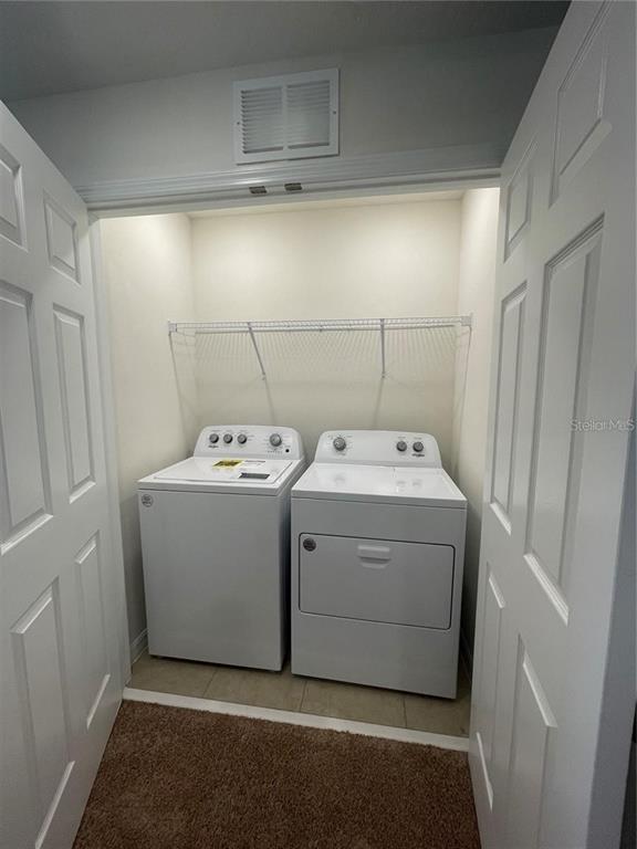 12264 Linear Street Orlando, FL 32832 - Photo 5 of 10 a utility room with dryer and washer