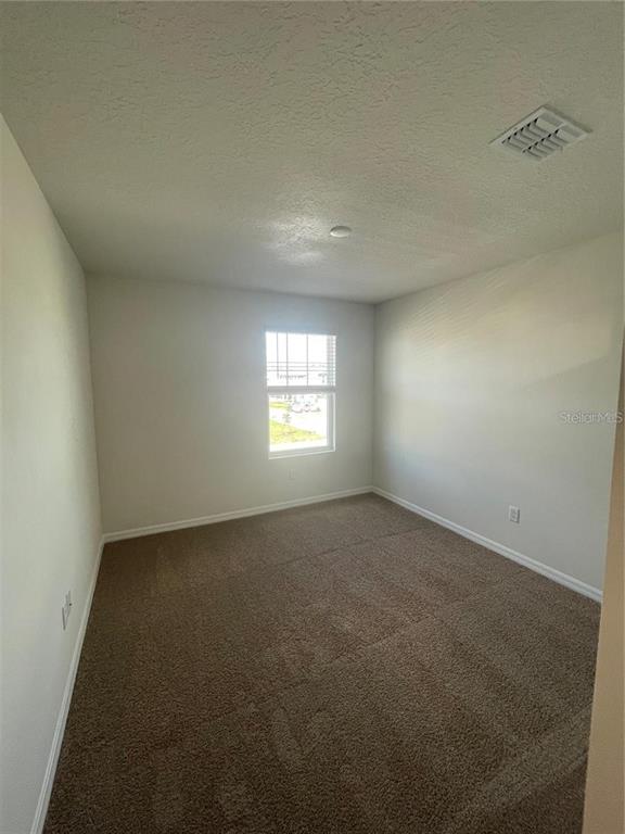 12264 Linear Street Orlando, FL 32832 - Photo 8 of 10 an empty room with a window