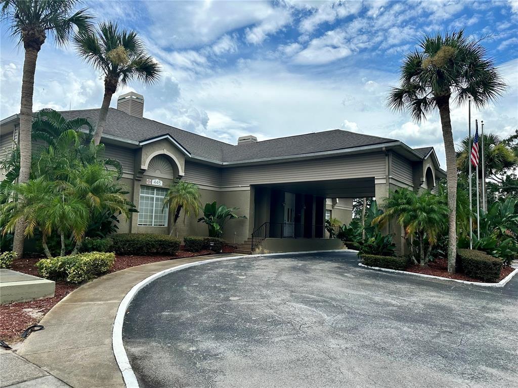 435 Wymore Road, Unit 207 Altamonte Springs, FL 32714 - Photo 16 of 17 a front view of a house with a yard
