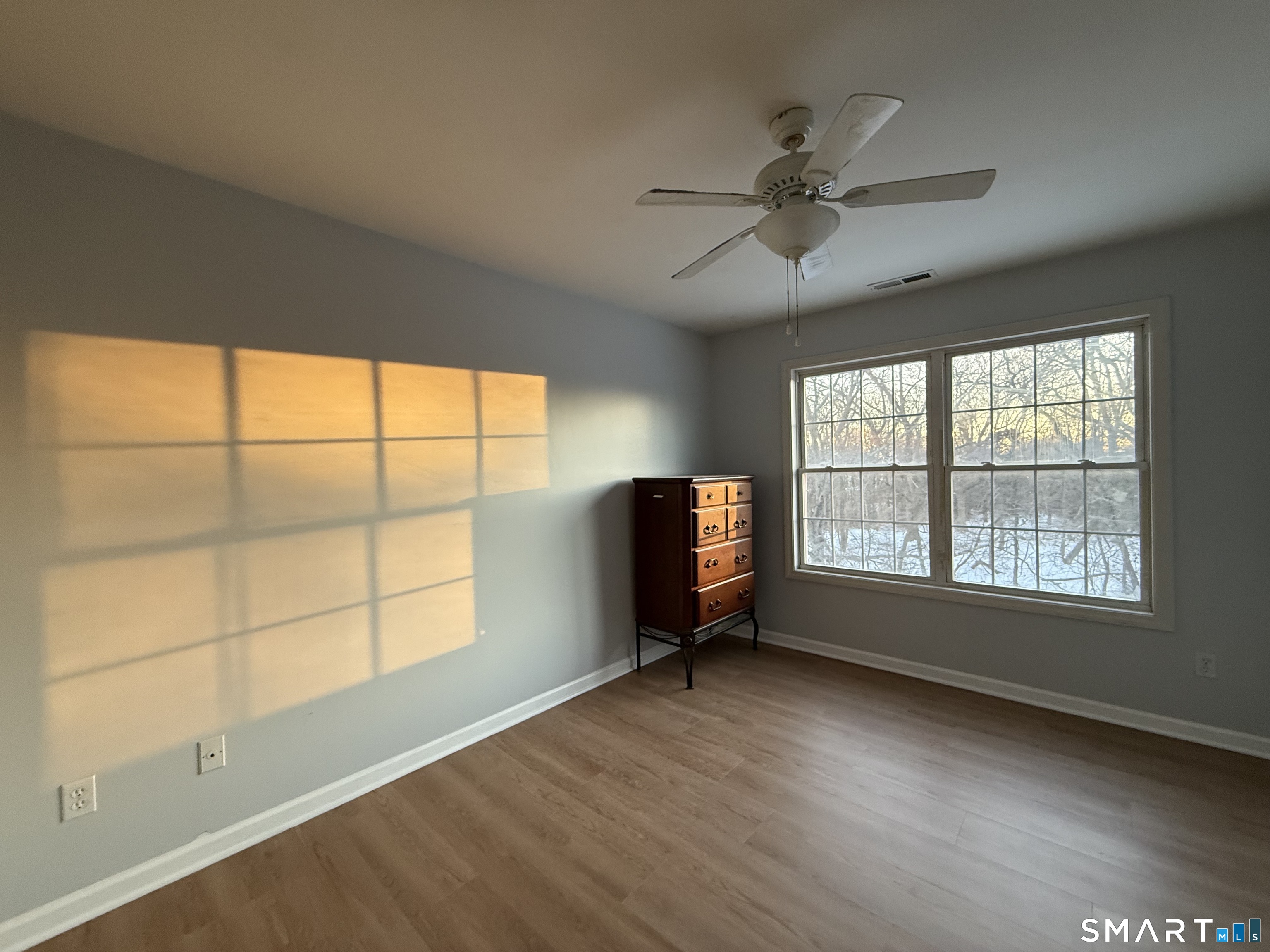 156 3rd Avenue West Haven, CT 06516 - Photo 4 of 17 wooden floor in an empty room with a window