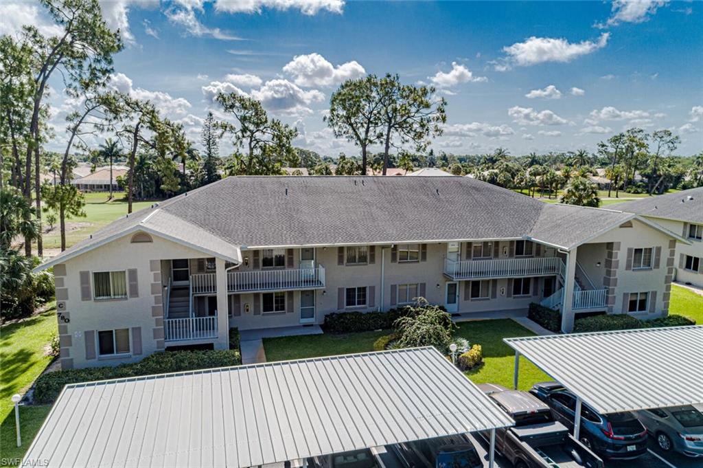 780 Augusta Boulevard, Unit C102 Naples, FL 34113 - Photo 1 of 26 a view of a house with a patio