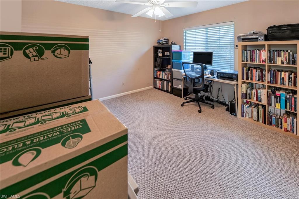 780 Augusta Boulevard, Unit C102 Naples, FL 34113 - Photo 17 of 26 a view of a workspace with furniture