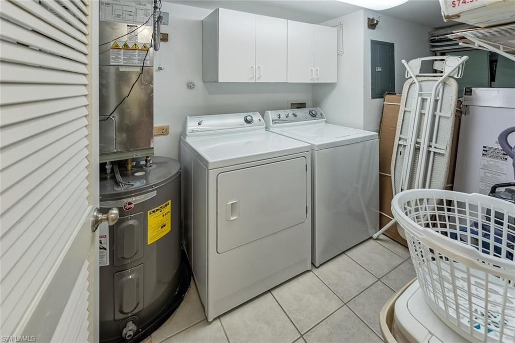 780 Augusta Boulevard, Unit C102 Naples, FL 34113 - Photo 19 of 26 a utility room with dryer and washer