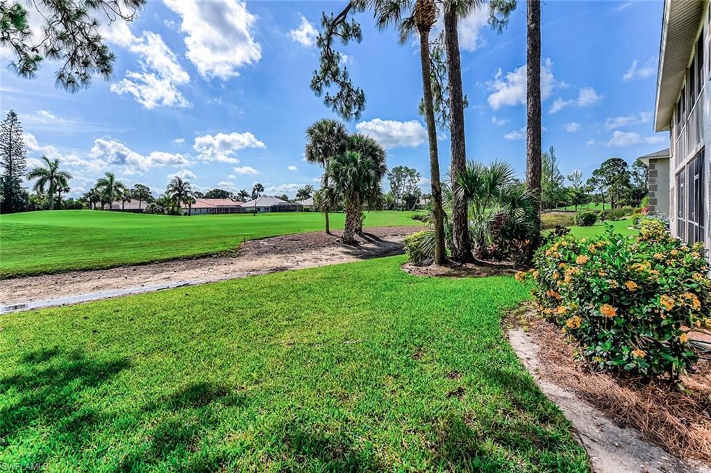 780 Augusta Boulevard, Unit C102 Naples, FL 34113 - Photo 4 of 26 a view of a park with large trees