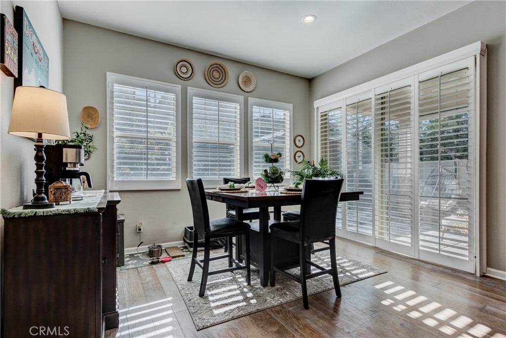 11137 Briar Rose Court Corona, CA 92883 - Photo 19 of 75 a view of a dining room with furniture window and outside view