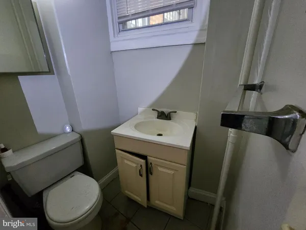 a bathroom with a toilet and a sink
